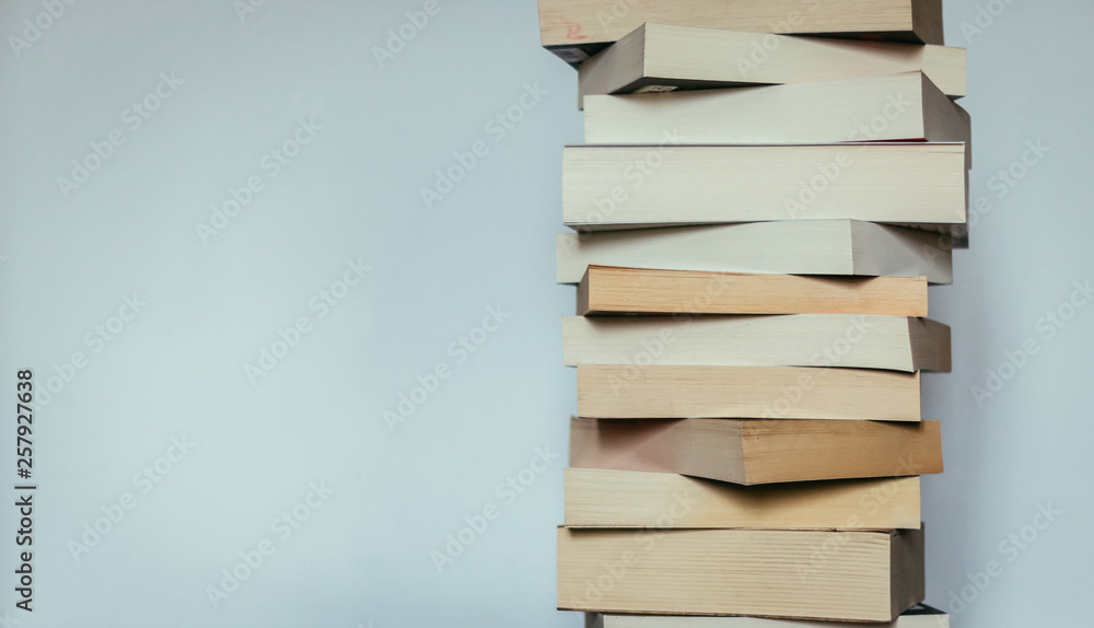 Literature for study: Stack of books; grey background Literature for study: Stack of books; grey background