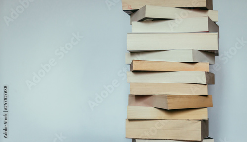 Literature for study: Stack of books; grey background