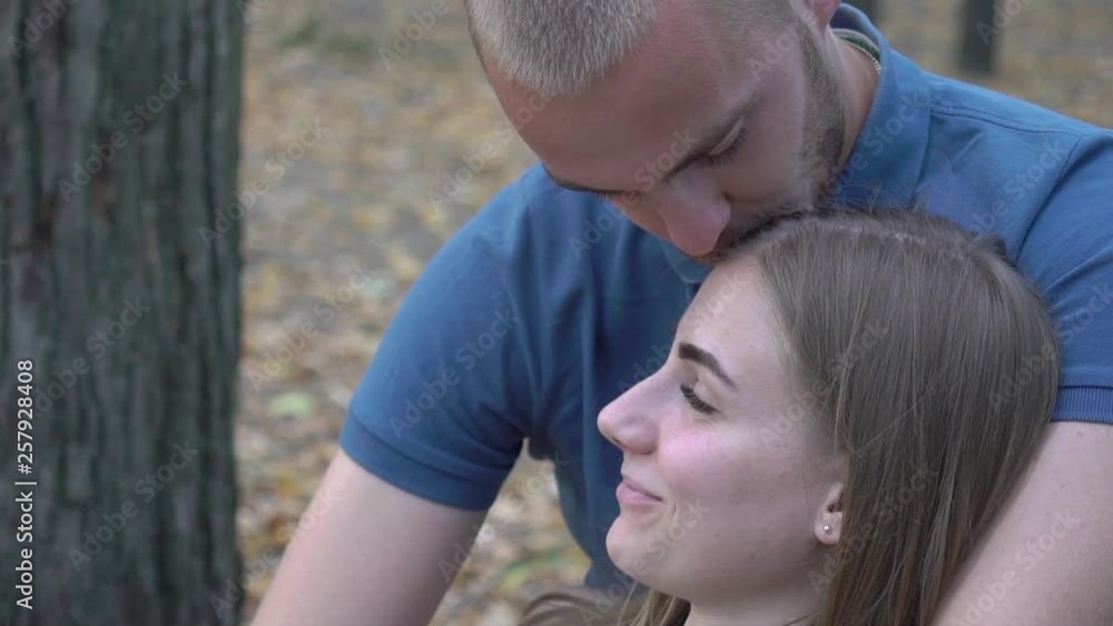 Slow Motion Portrait Of Happy Couple Relaxing In The Park Slow Motion Portrait Of Happy Couple Relaxing In The Park