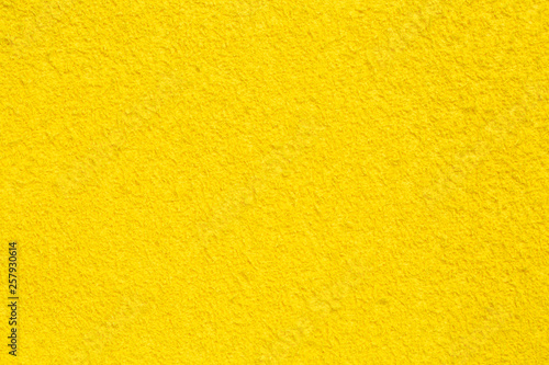 Grungy yellow background. Colored material for decoration.