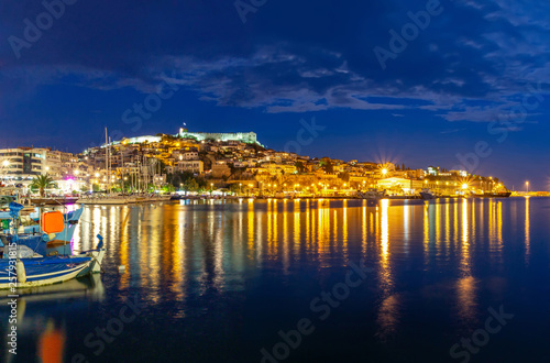 Great spring seascape on Aegean Sea. Colorful evening panorama of Kavala city, the principal seaport of eastern Macedonia and the capital of Kavala regional unit. Greece, Europe.