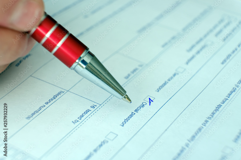 Schengen visa, questionnaire. Hand with pen completing a questionary. Schengen visa, questionnaire. Hand with pen completing a questionary.