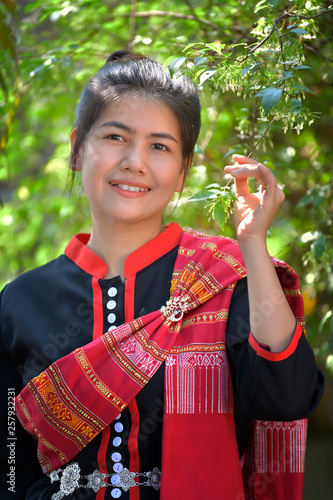 Asian women in Phutai costume and green background photo