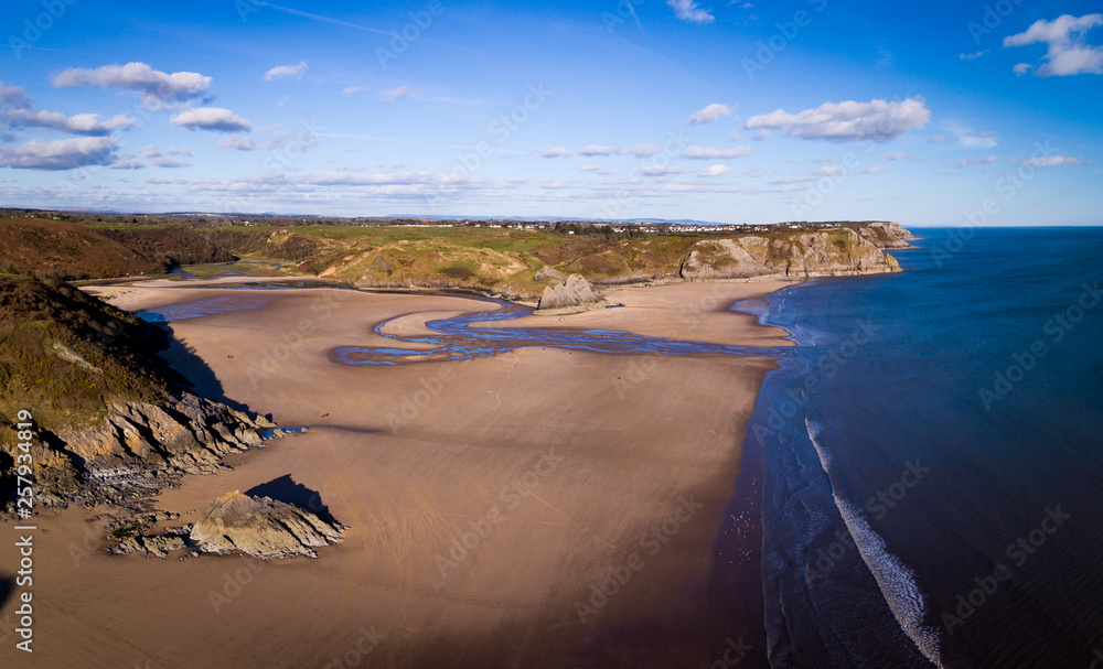 Aerial view of Three Cliffs Bay south coast beach the Gower Peninsula Swansea Wales uk