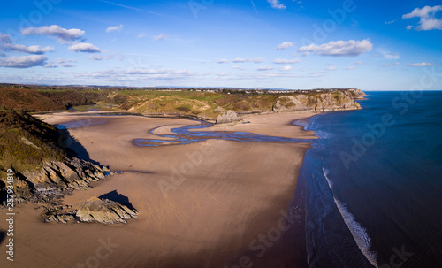 Aerial view of Three Cliffs Bay south coast beach the Gower Peninsula Swansea Wales uk photo