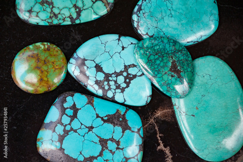 Close up of polished turquoise stones photo