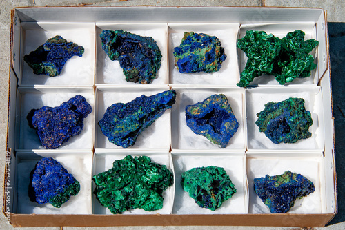 Close up of azurite and malachite mineral specimens in a box photo