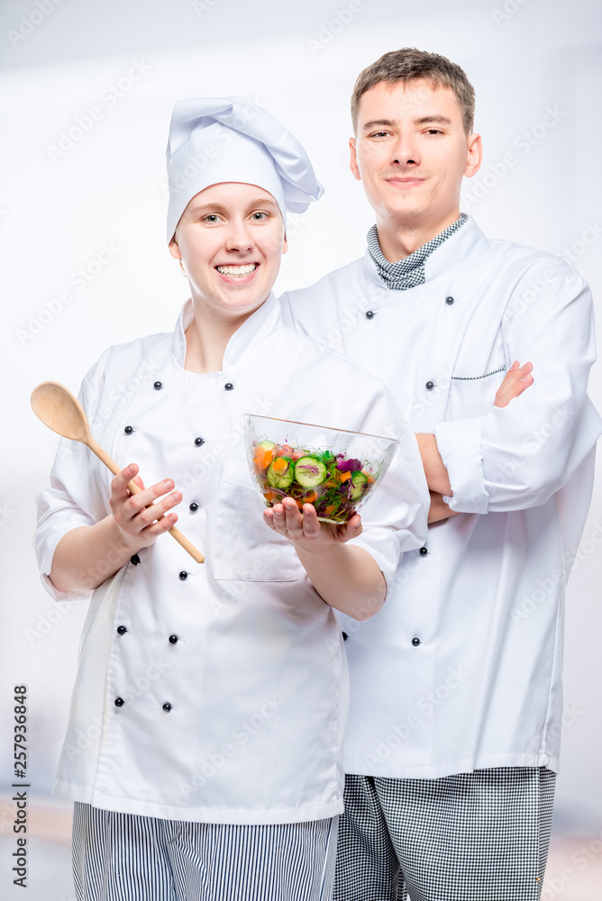 vertical portrait of successful chefs with salad vertical portrait of successful chefs with salad