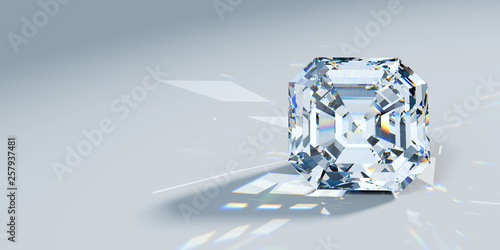 Close-up asscher cut diamond with caustics rays on light blue background photo