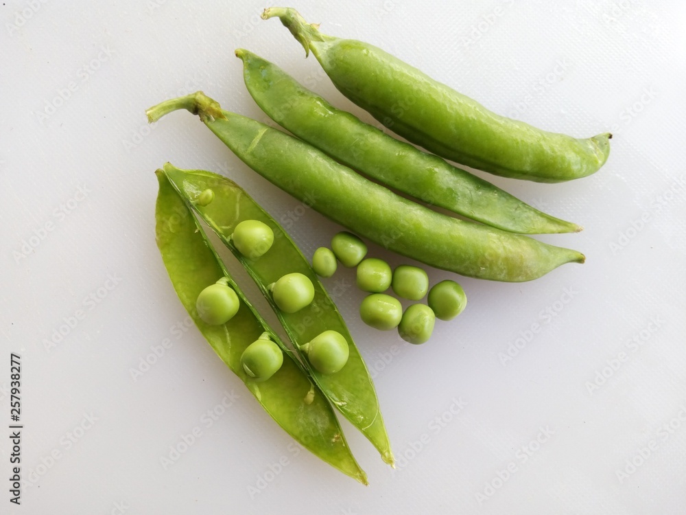 fresh green peas on white background fresh green peas on white background
