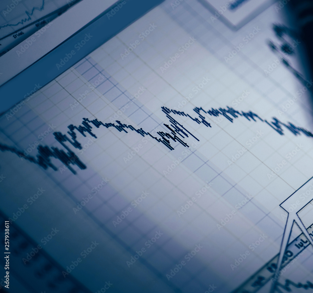 Business graph analysis report. Accounting with pen on documents Business graph analysis report. Accounting with pen on documents