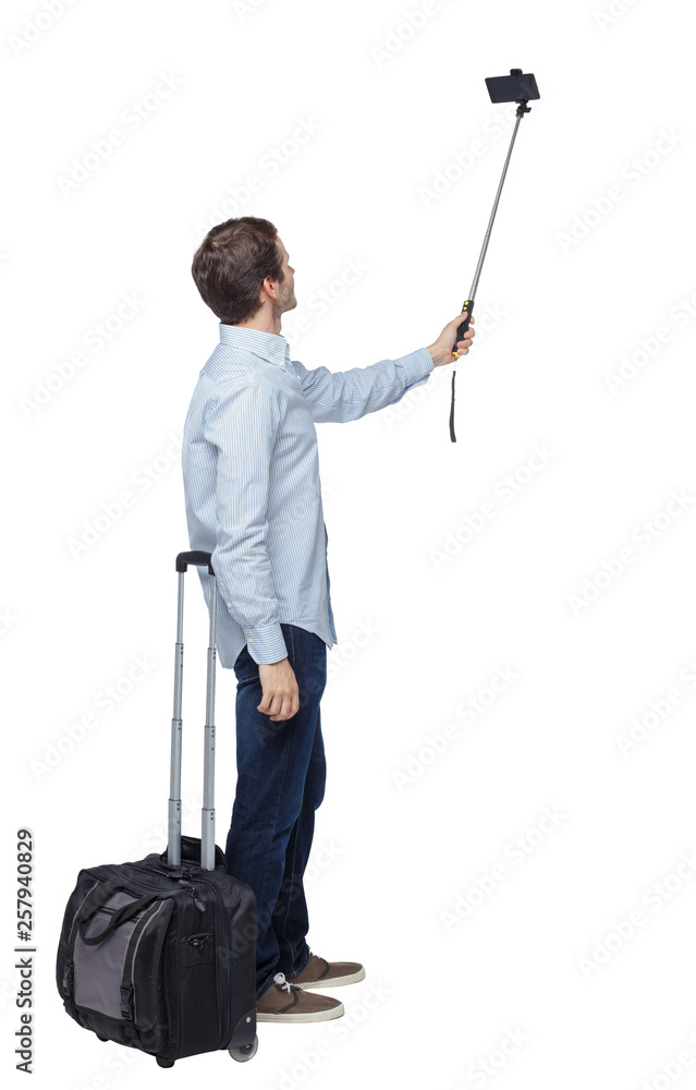 Back view of business man with suitcase with smartphone. Back view of business man with suitcase with smartphone.
