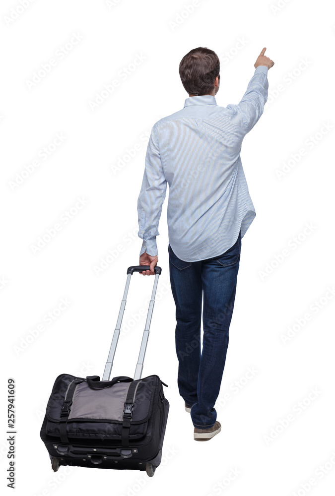 Back view of walking pointing business man with suitcase. Back view of walking pointing business man with suitcase.