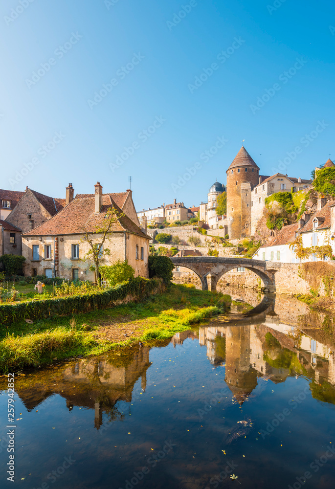 View of bridge with houses reflected in water View of bridge with houses reflected in water