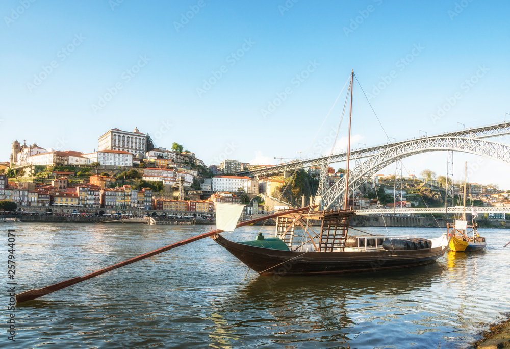Ancient ship with the barrels of port on Douro River. Porto, Portugal.