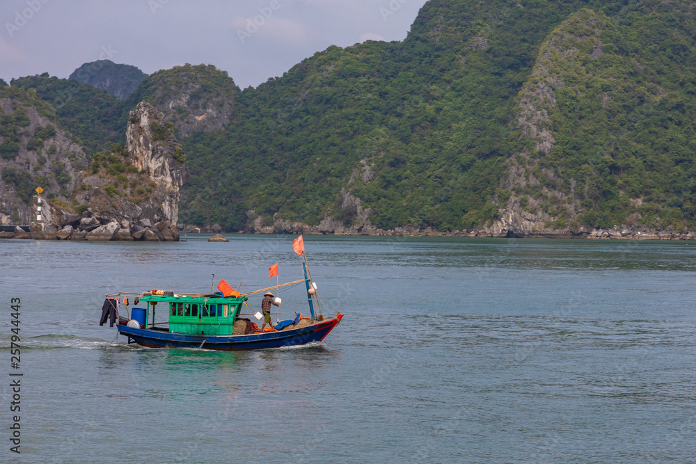 HA LONG BAY, VIETNAM - NOVEMBER 13, 2018: Halong Bay, Vietnam. Unesco World Heritage Site. Traditional tourist boats.