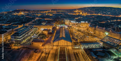 Budapest, Hungary - Aerial panoramic skyline view of Budapest at dusk with illuminated Western Railway Station, Parliament, St. Stephen's Basilica, Buda Castle Royal Palace and Fisherman's Bastion