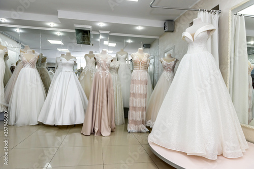 Interior of bridal salon, wedding dresses on mannequins