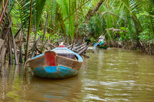 Traditional boat. Mekong River in My Tho city. Mekong Delta region of southern Vietnam. photo