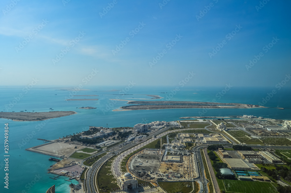 Bird's eye and aerial drone view of Abu Dhabi city from observation deck