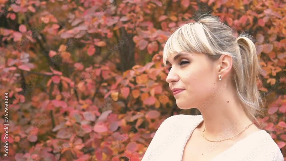 Real Time Young Beautiful Woman In The Park In Autumn Day - Closeup Real Time Young Beautiful Woman In The Park In Autumn Day - Closeup