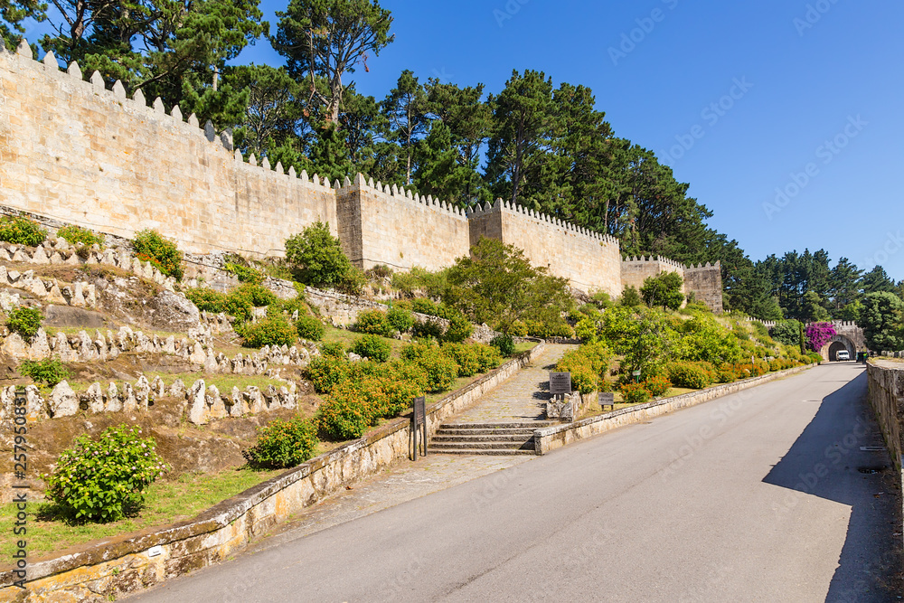 Naklejka premium Baiona, Spain. The wall of the fortress of Monterreal, XI - XVII centuries. The fortress is included in the list of the most picturesque historical buildings of UNESCO