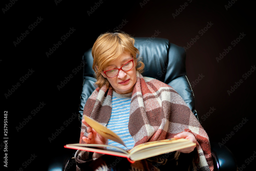 woman reading a book wrapped in a blanket woman reading a book wrapped in a blanket