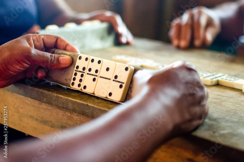 Women are playing domino which is traditional in Cuba photo