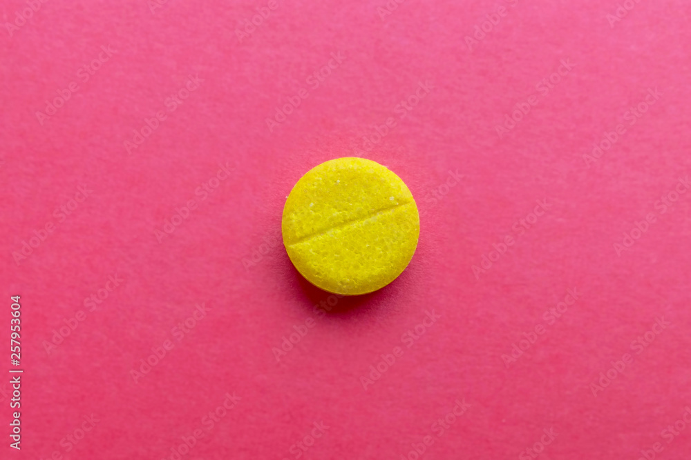  pill LSD on red blurred background