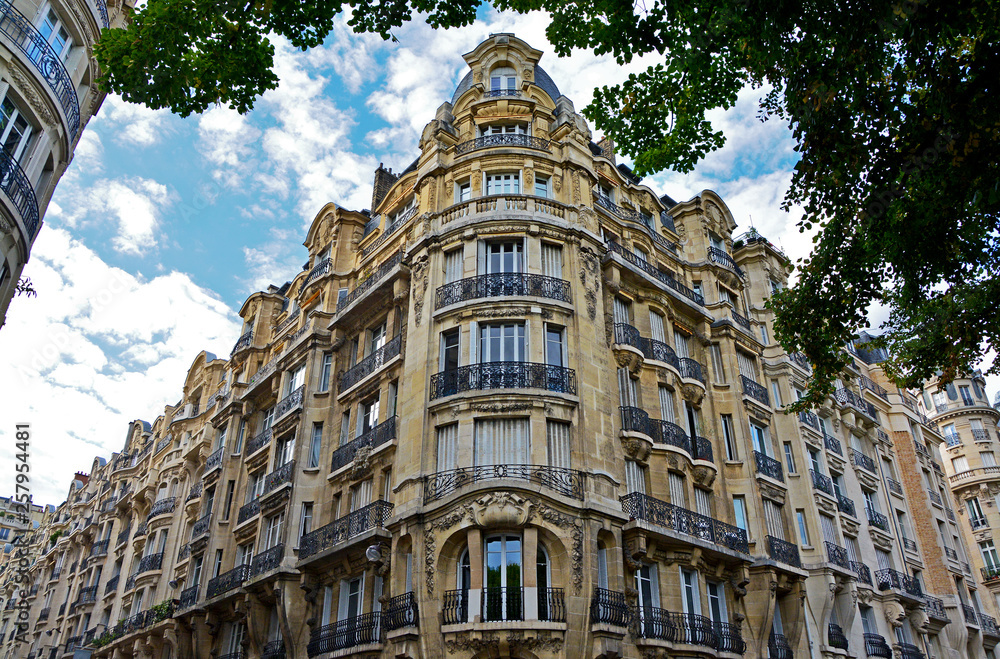 Facade of typical house with balcony in Paris. City, urban view on building in Paris, France