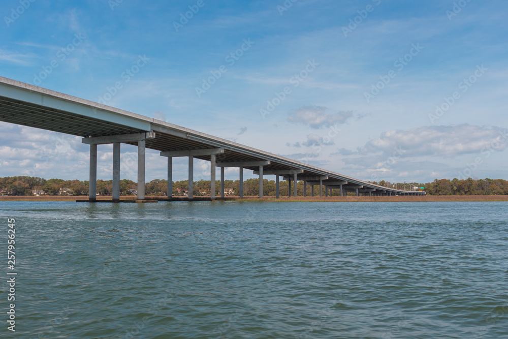 Beautiful, long concrete beam bridge spans the inter coastal waters of Hilton Head Island, South Carolina, USA.