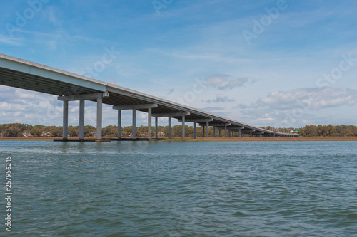 Beautiful, long concrete beam bridge spans the inter coastal waters of Hilton Head Island, South Carolina, USA. © JBStudios