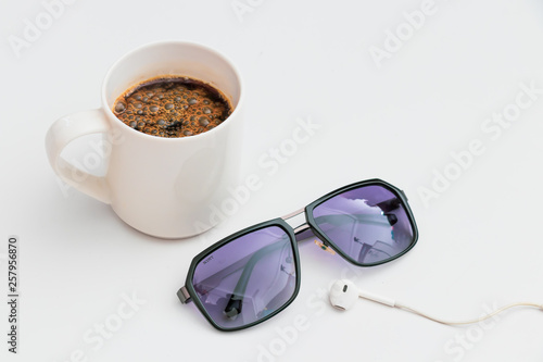 Top view coffee and sunglasses on Flat lay