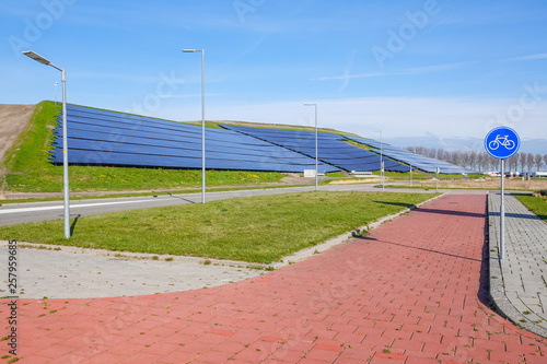 A hilside ful of solar panels providing clean electric power © mjowra