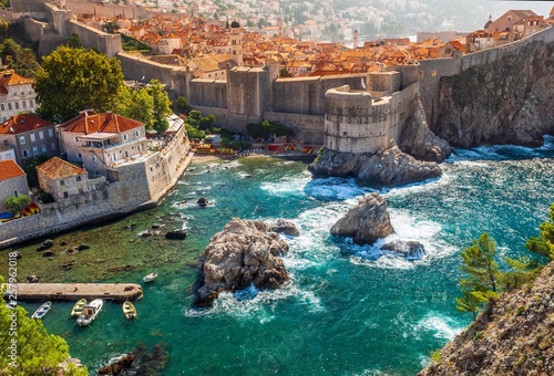 Dubrovnik fortification wall and old city on sunset. photo