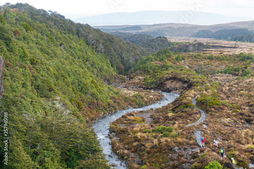 Hikers on Trail along Wairere Stream at Tongariro National Park in New Zealand