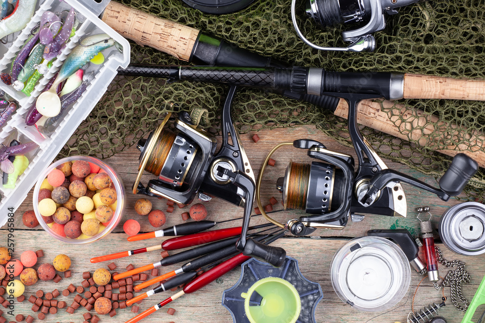 fishing tackle on a wooden table. fishing tackle on a wooden table.