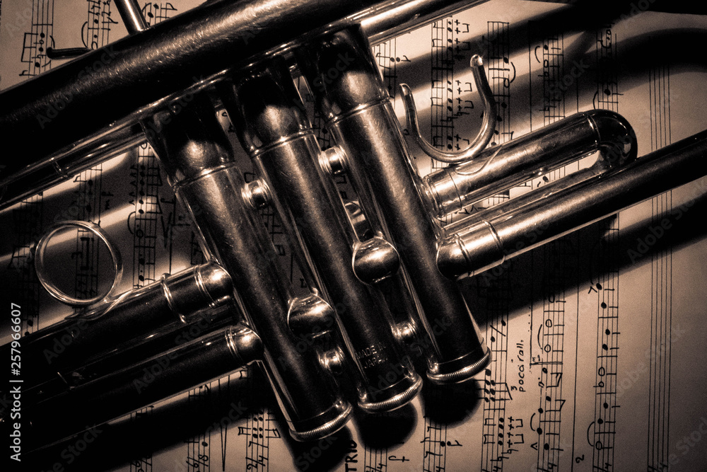 Naklejka premium Background of a trumpet on sheet music