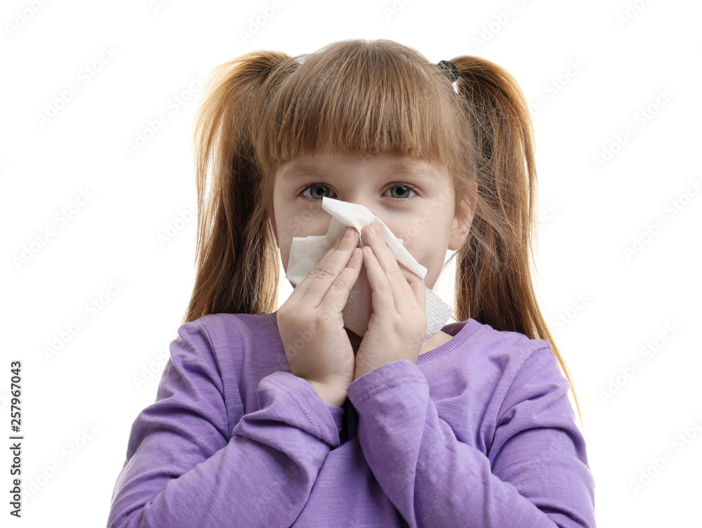 Cute little girl blowing nose against white background Cute little girl blowing nose against white background