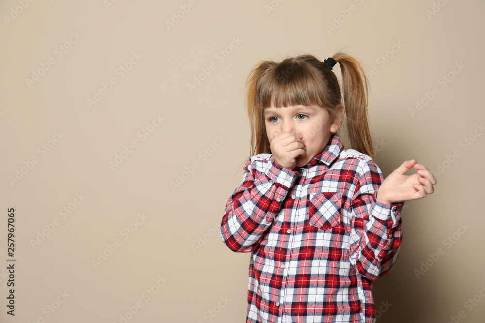 Cute little girl coughing against color background. Space for text Cute little girl coughing against color background. Space for text