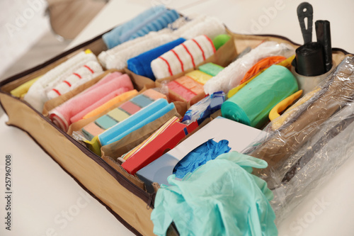 Large organizer with cleaning supplies on table indoors