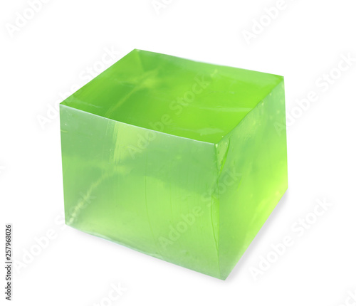 Delicious green jelly cube on white background
