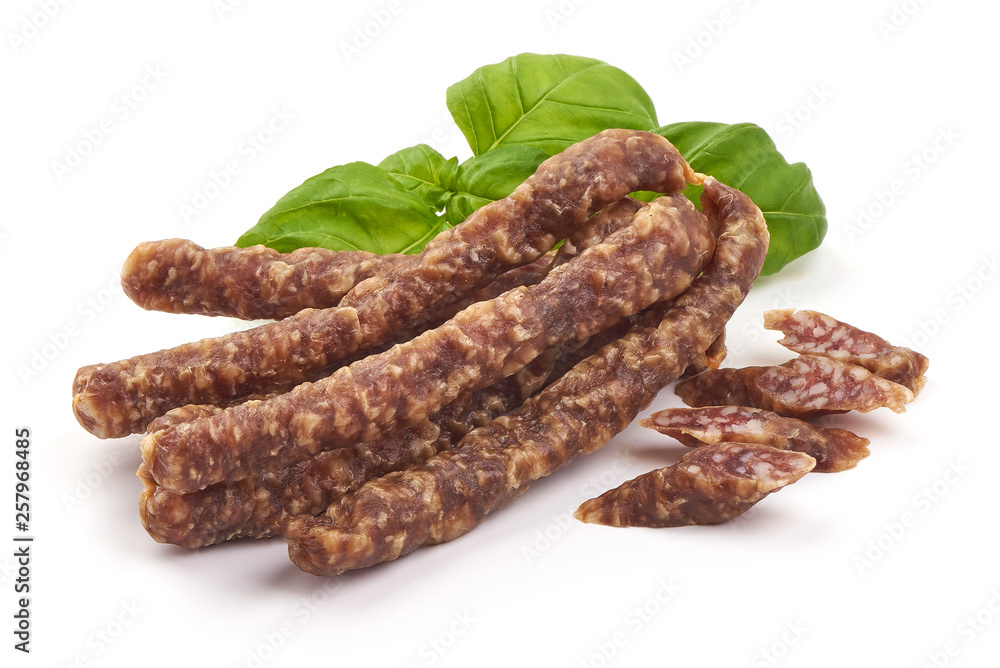 Dried thin pork sausages, smoked meat, close-up, isolated on white background Dried thin pork sausages, smoked meat, close-up, isolated on white background
