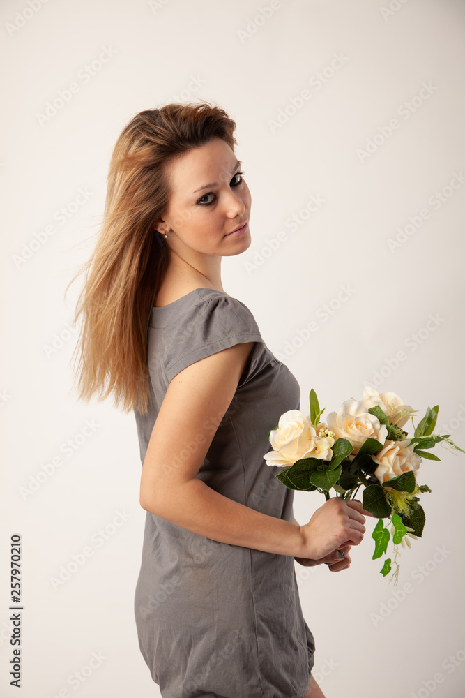 Beautiful blond girl posing for photo in studio Beautiful blond girl posing for photo in studio