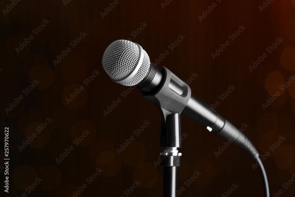 Microphone on dark background, space for text Microphone on dark background, space for text