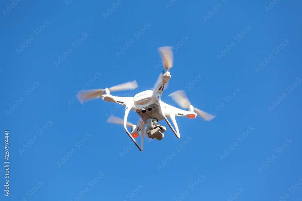 Flying drone with blue sky background, technology Flying drone with blue sky background, technology