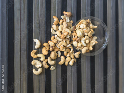 Healthy food for background image close up cashew nuts. Nuts texture on top view on the cup plate