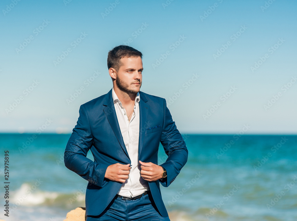 Groom getting ready in the morning for wedding ceremony on the beach Groom getting ready in the morning for wedding ceremony on the beach