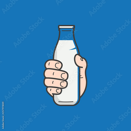 Hand hold milk bottle. Male hand holding a milk