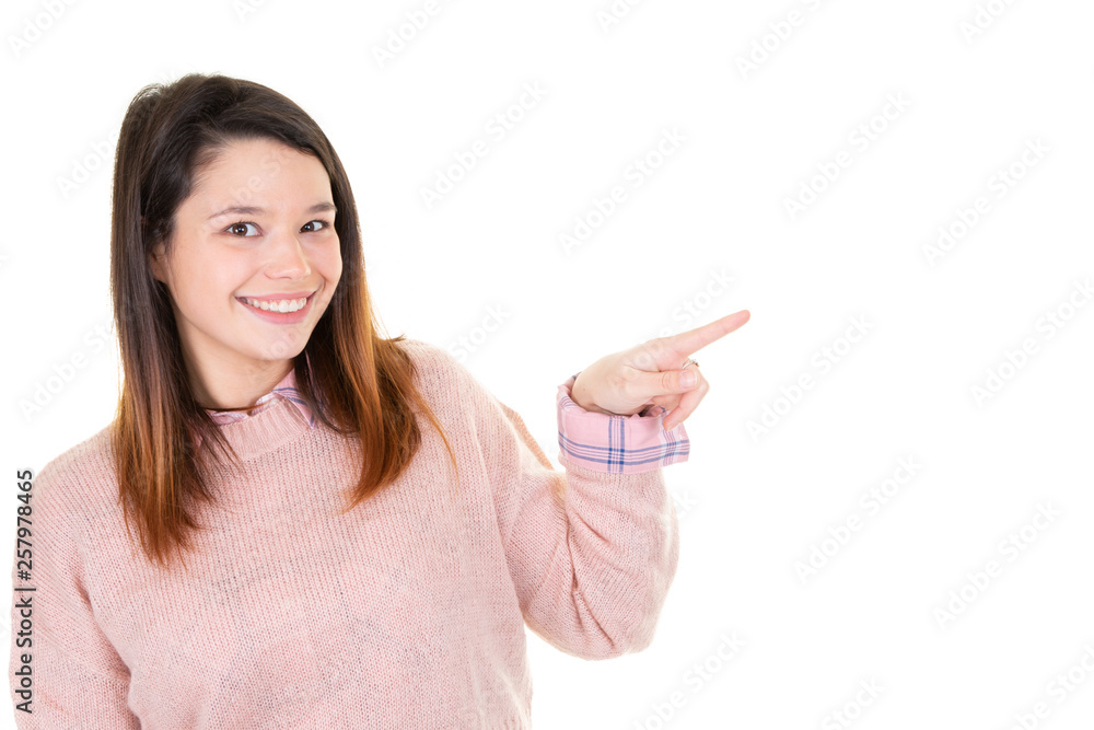 young woman pointing at copyspace in white background young woman pointing at copyspace in white background